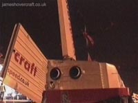 The rear doors seen open here, during unloading of cars. A hoverspeed tractor would approach the craft after each arrival with the moveable ramp shown, which would then be fixed to the craft and vehicles then allowed to drive down it, off the pad, and through to immigration. The APU exhaust can clearly be seen here also.